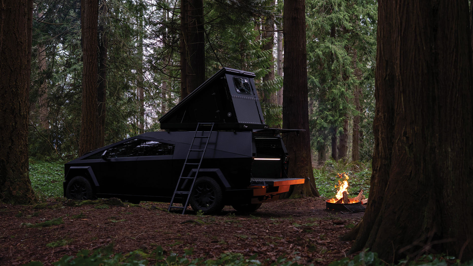 Cybertruck in the woods with rooftop tent installed on The Cap