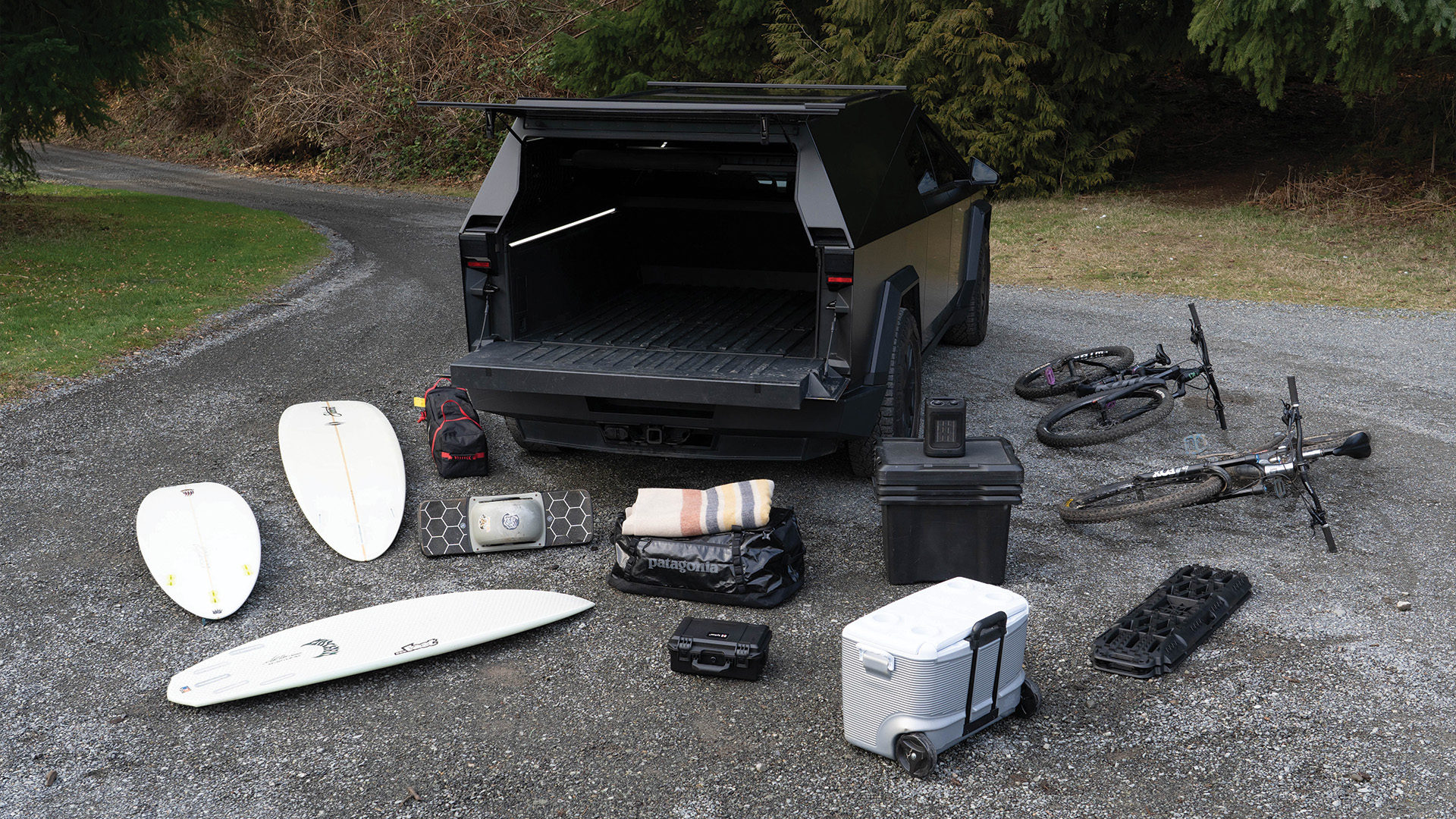 Cybertruck with truck cap and gear on the ground