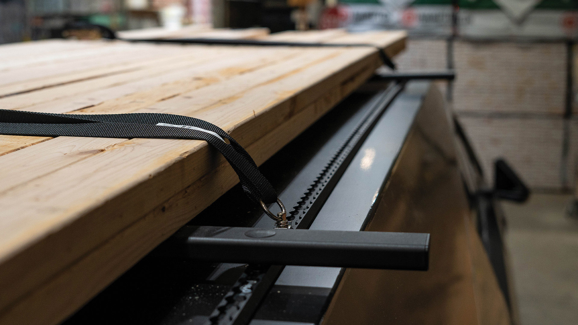 Truck cap with lumber strapped to crossbars